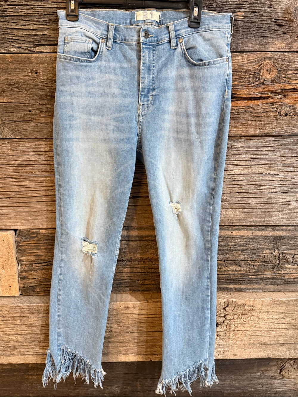 Free People Light Wash Distressed Cropped Jeans with Frayed Ankles